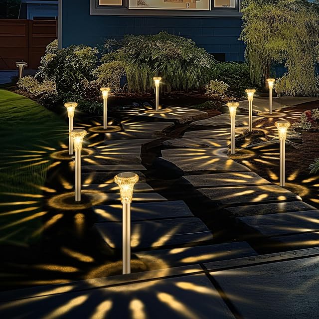 SonPen solar path lights with diamond-cut heads in a garden